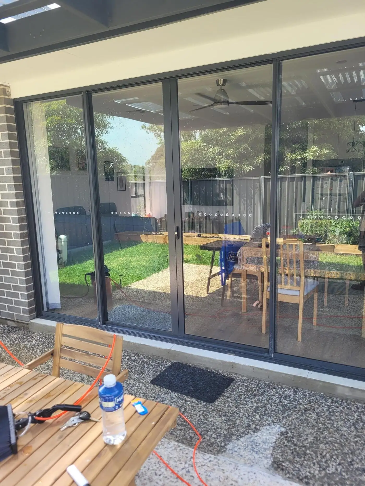 After: crisp, streak-free sliding glass doors opening onto a patio